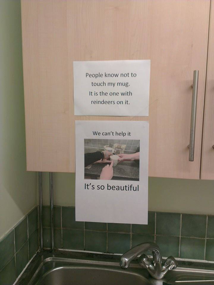 coworkers took photo of them touching mug coworker made sign about not touching
