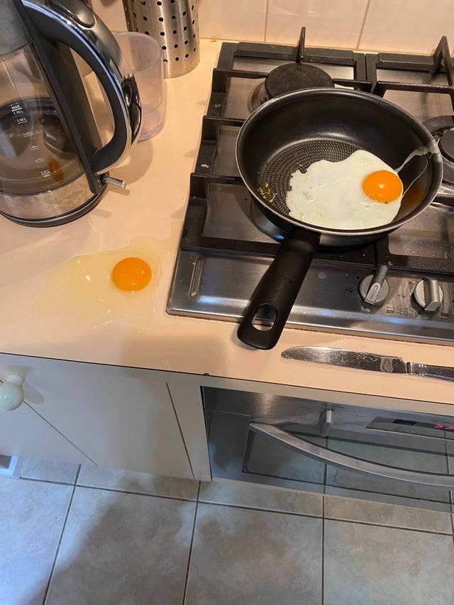 1 egg in pan, one on counter