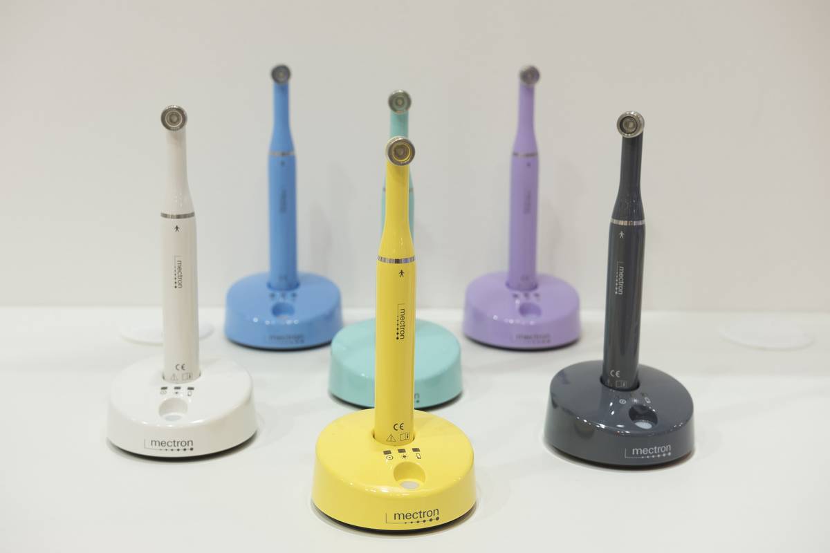 Electric toothbrushes on charging stands