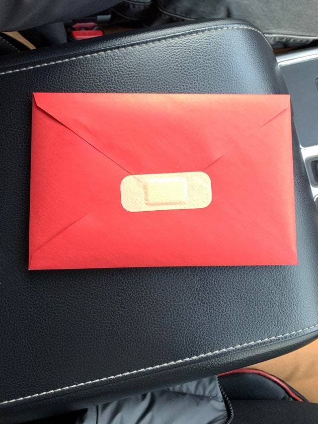 envelope sealed with bandaid 