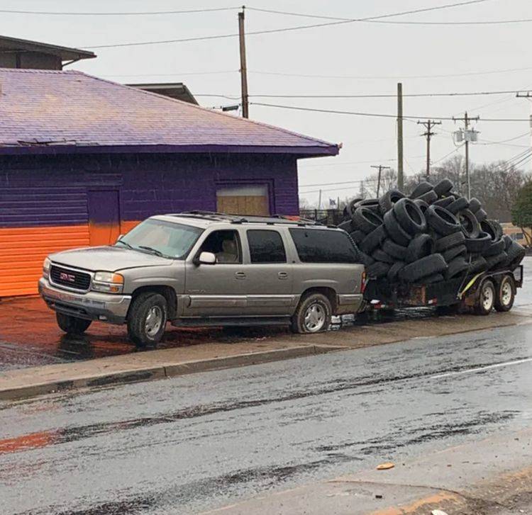 car hauling tires with a flat tire