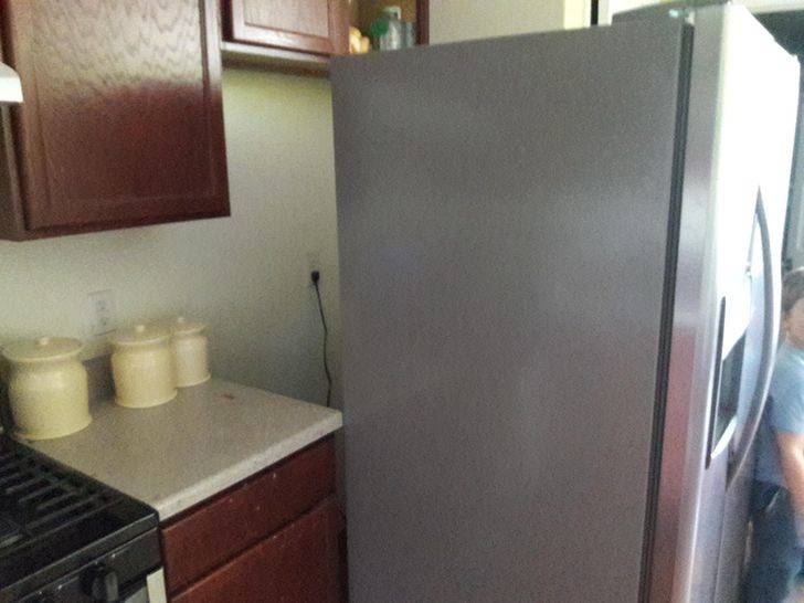 fridge order gone wrong, leaving a ton of space behind it