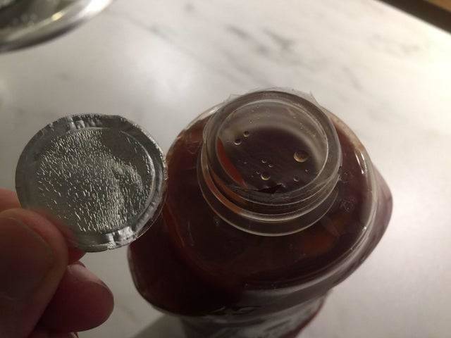 foil cap off but plastic still on