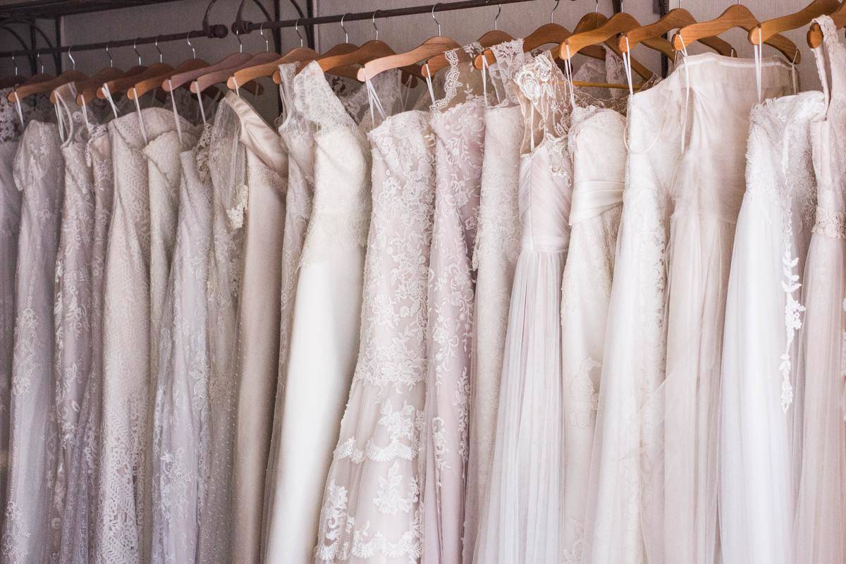 row of wedding dresses hanging