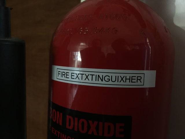 misspelled label on fire extinguisher