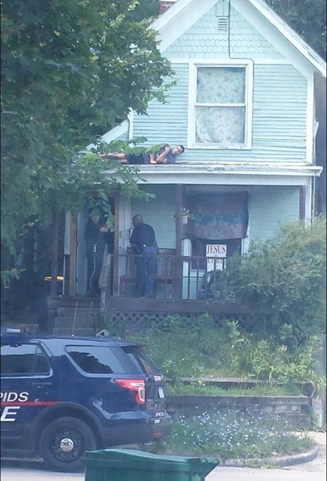 man on roof hiding from cops