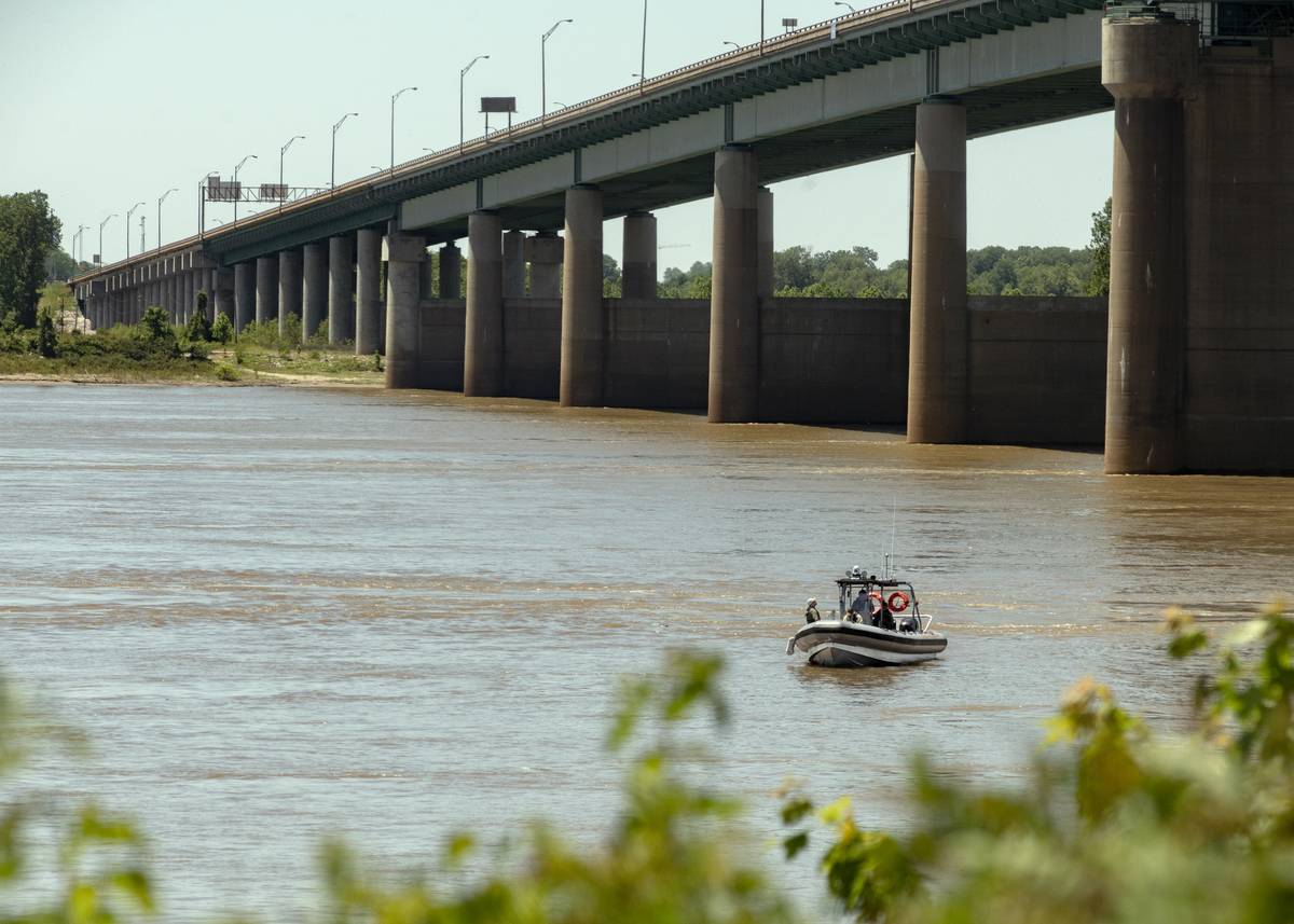 A boat travels along the Mississippi River near Interstate 40 Hernando DeSoto Bridge in Memphis, Tennessee, U.S