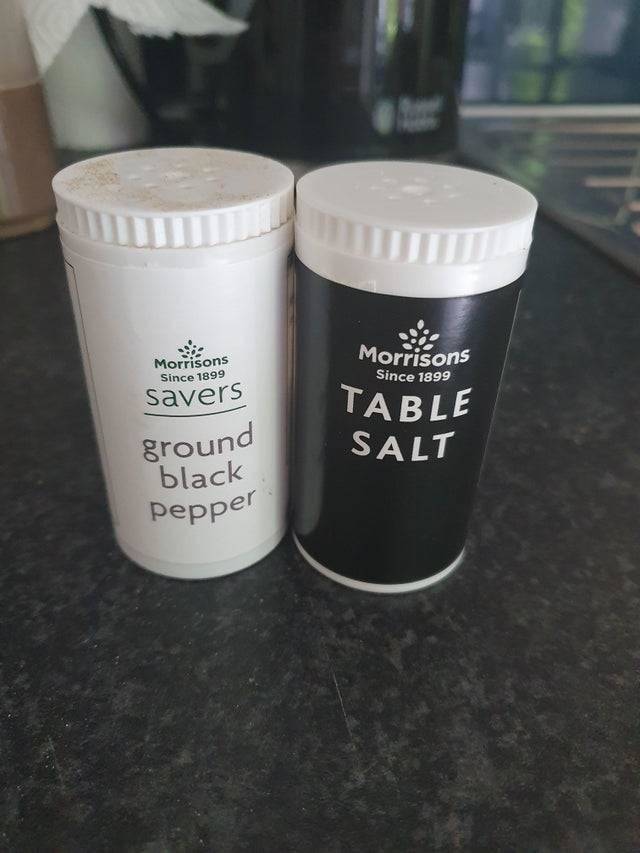white pepper shaker and black salt shaker