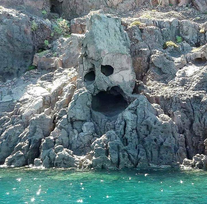 cave over water looks like face