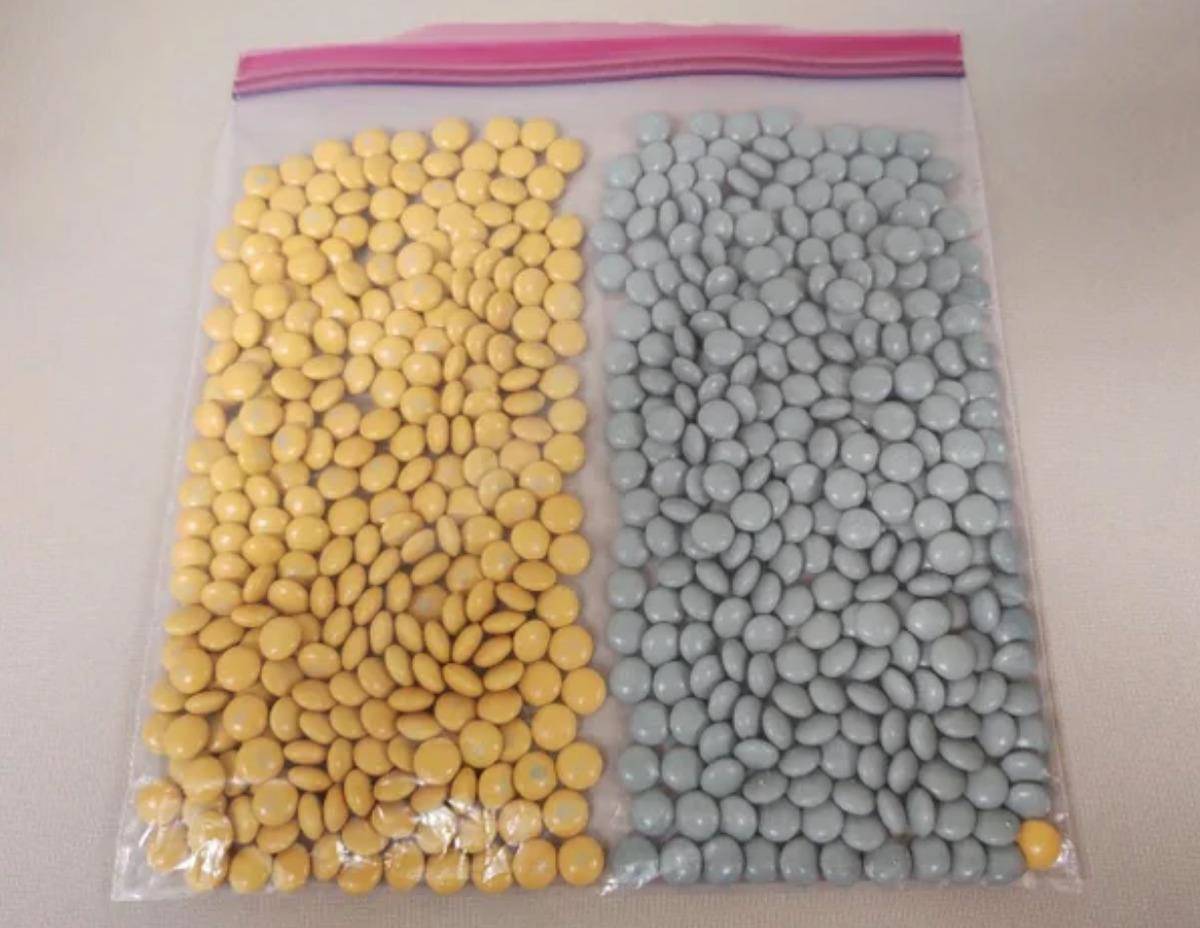 bag with perfectly color separated beans apart from one