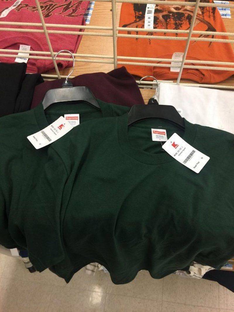 green shirts on hangers lying down