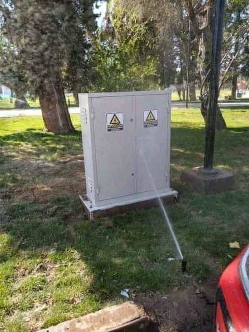 sprinkler pointing at electrical box