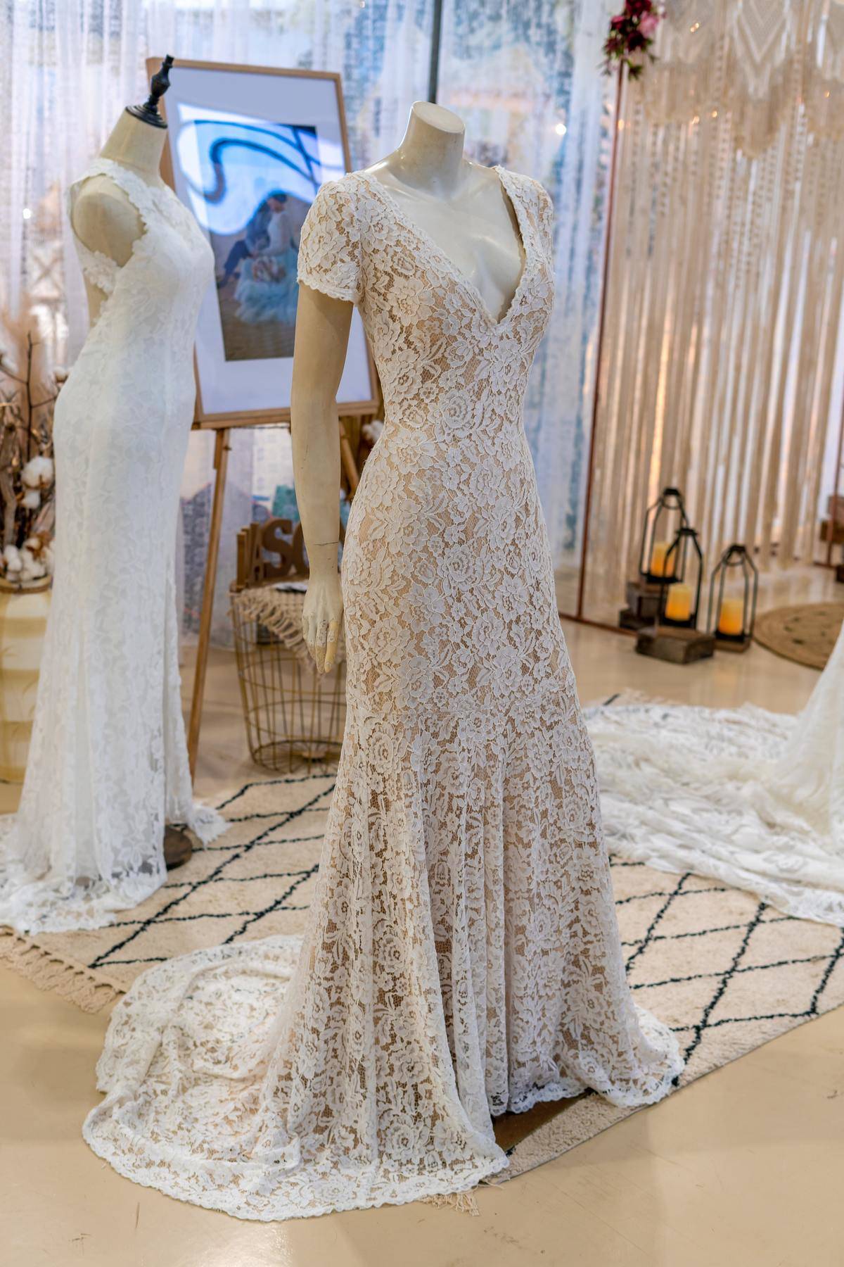 wedding dresses on mannequin in bridal shop