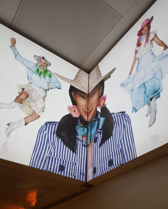 photo of woman in corner so her head is distorted