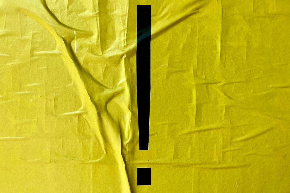 Artistic exclamation point on yellow background