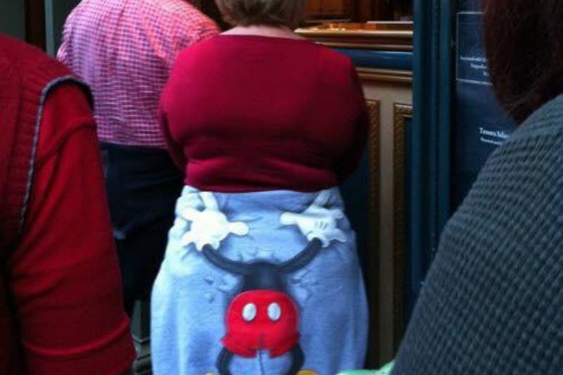 Mickey Mouse hoodie wrapped around someone's waist so it looks like he's grabbing their bum