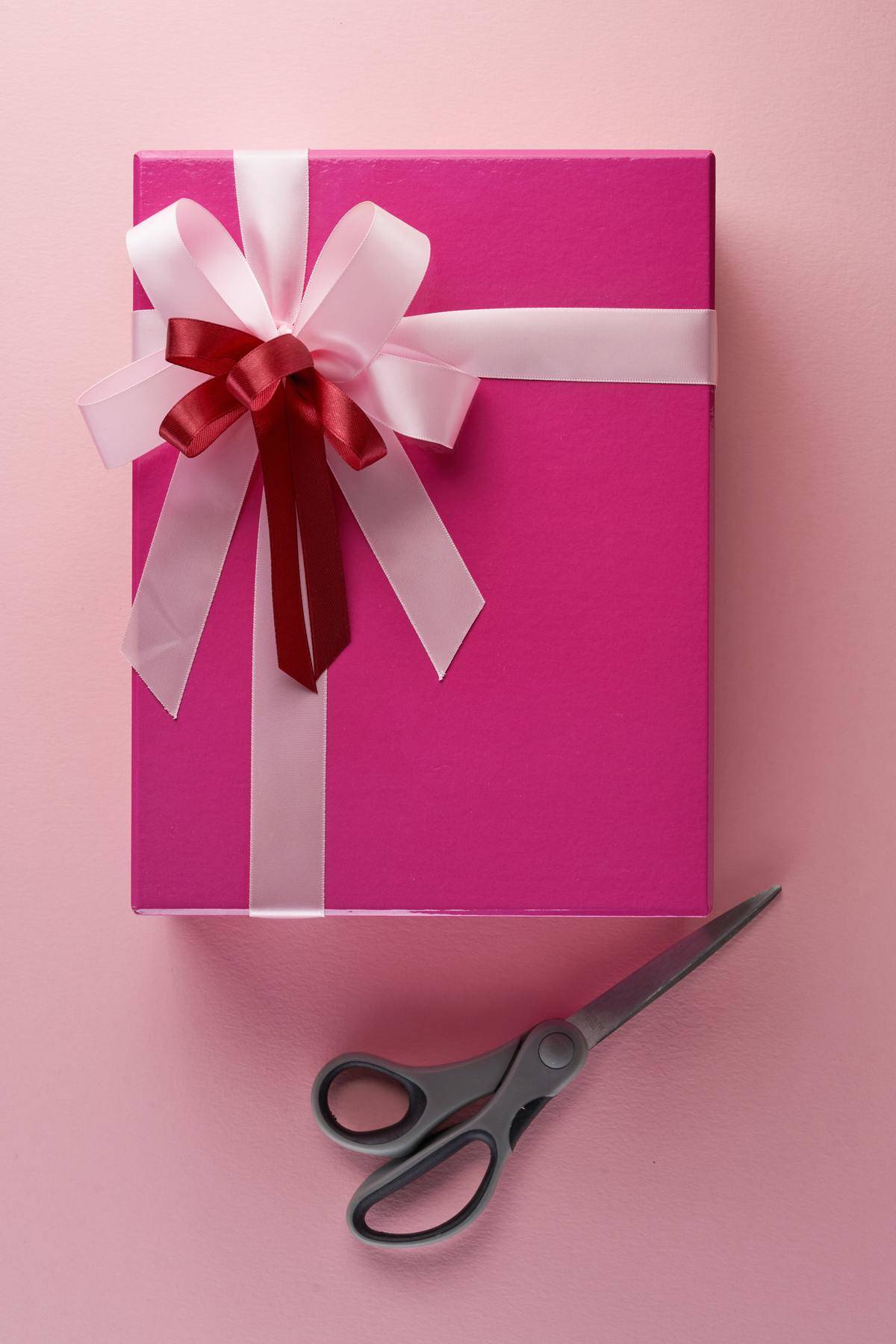 Present wrapped with pink wrapping paper and ribbons
