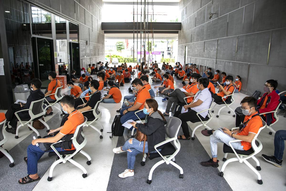 Employees of FPT Software Co. are socially distanced