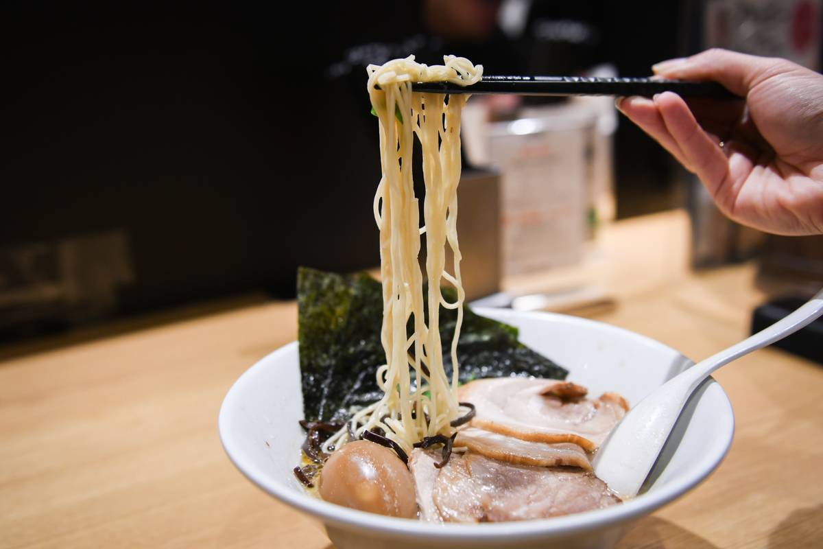 A bowl of 'Shiromaru Motoaji' ramen at an Ippudo ramen restaurant in Tokyo, Japan