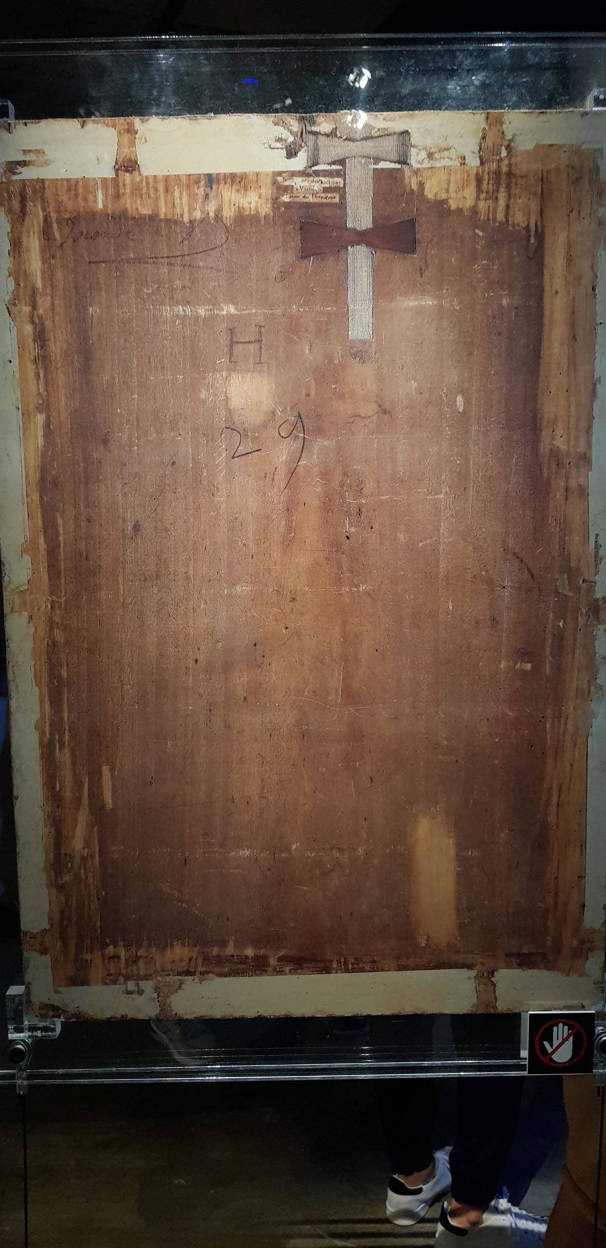A picture of the back side of the frame for the Mona Lisa