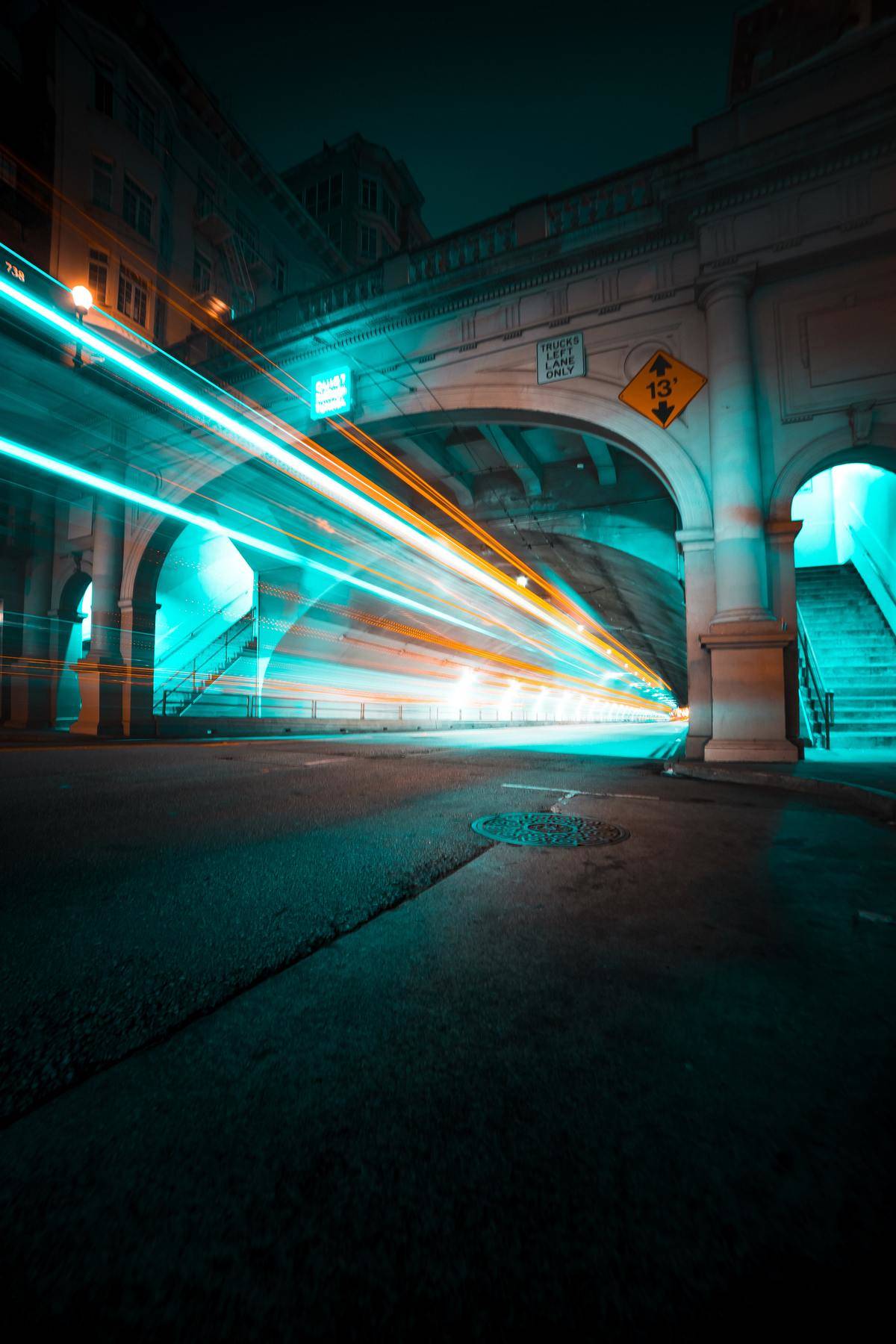 Time-lapse photo of car lights in a tunnel