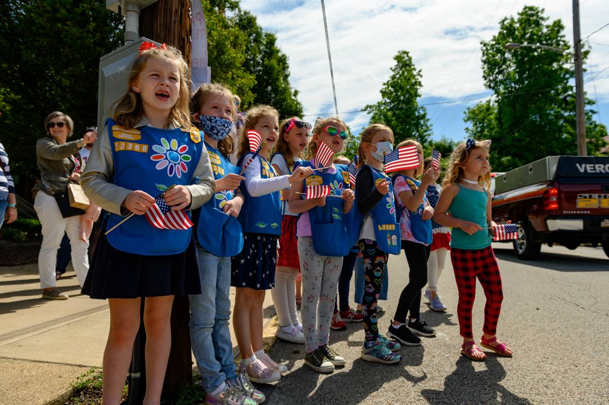 Girl Scouts in Troop 52368 wait for candy and watch parade marchers during the 2021 Oakmont-Verona Memorial Day Parade