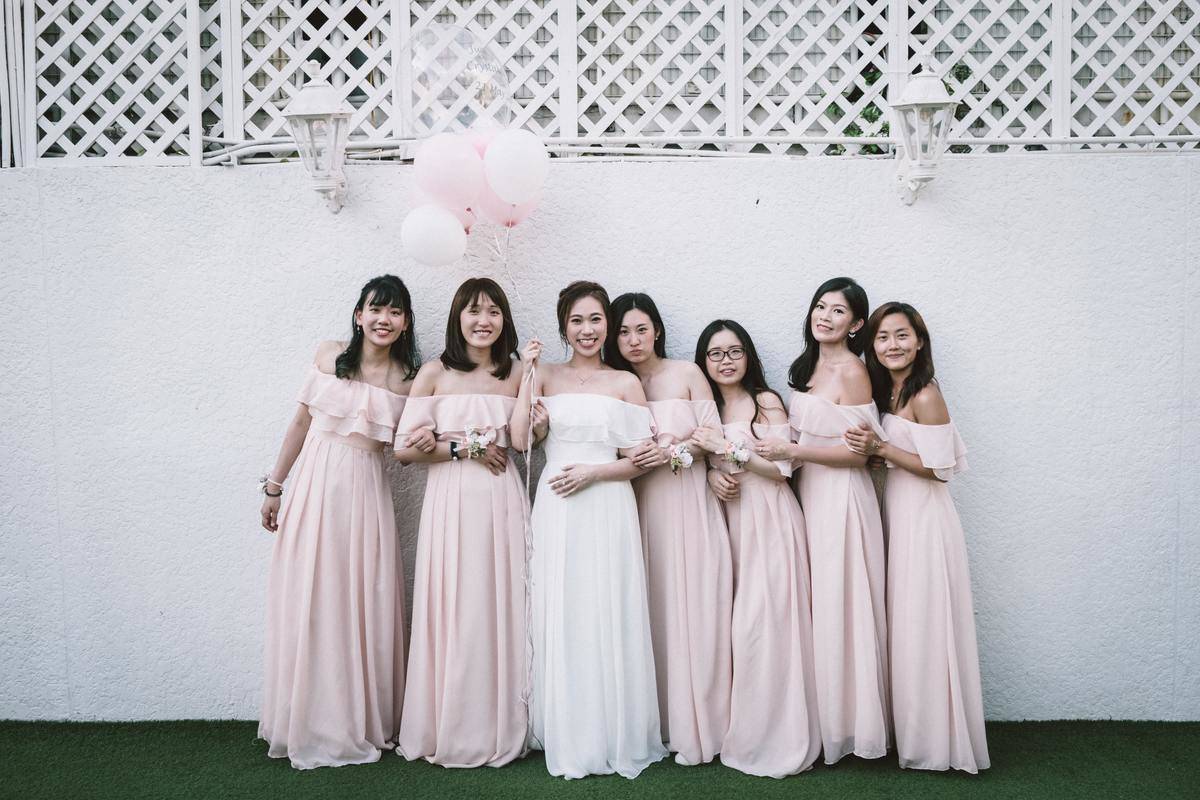 outdoor bride with bridesmaids in pink gown