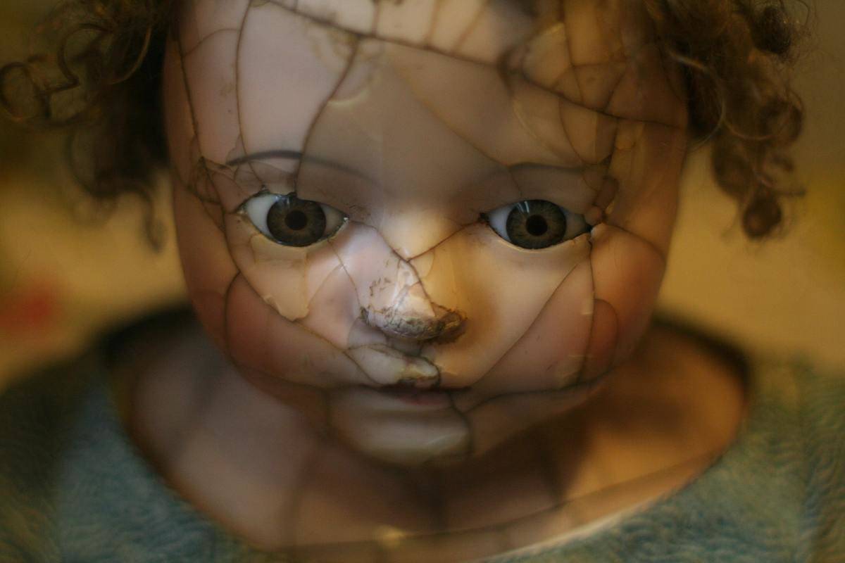 doll with broken face looking creepy