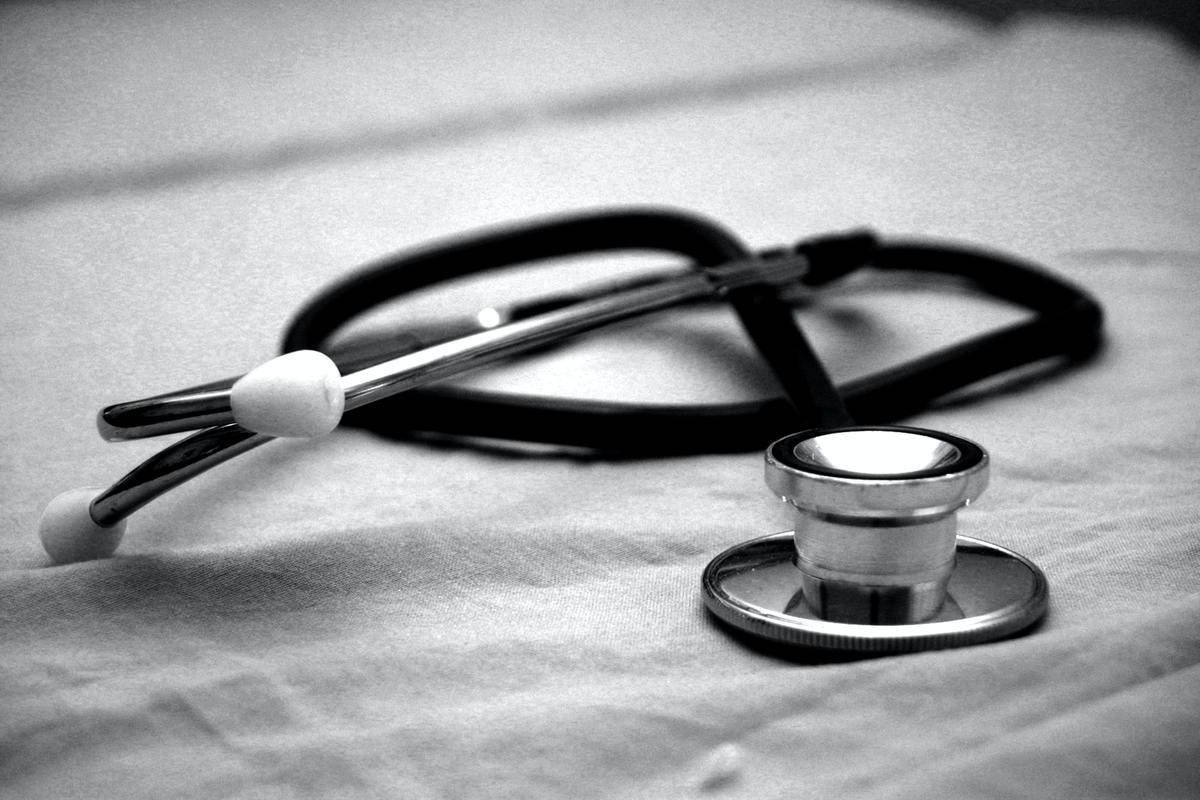 a black and white closeup of a stethoscope