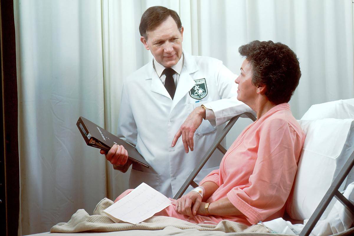 doctor talking to a patient in the hospital