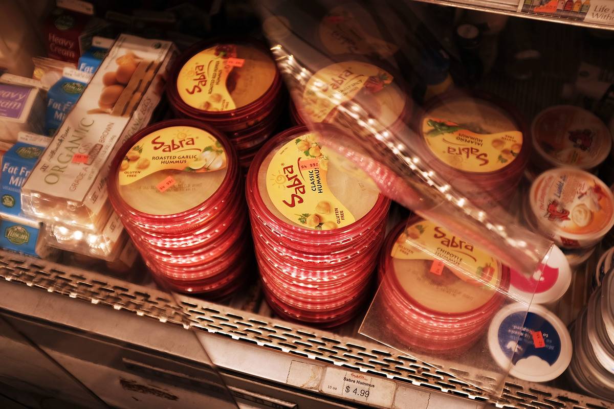 Containers of Sabra hummus are for sale at a supermarket.