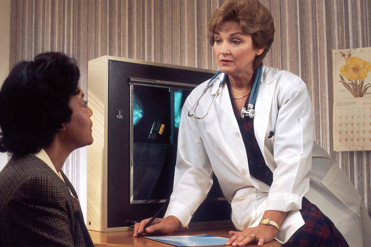 doctor talking to a patient in a retro office