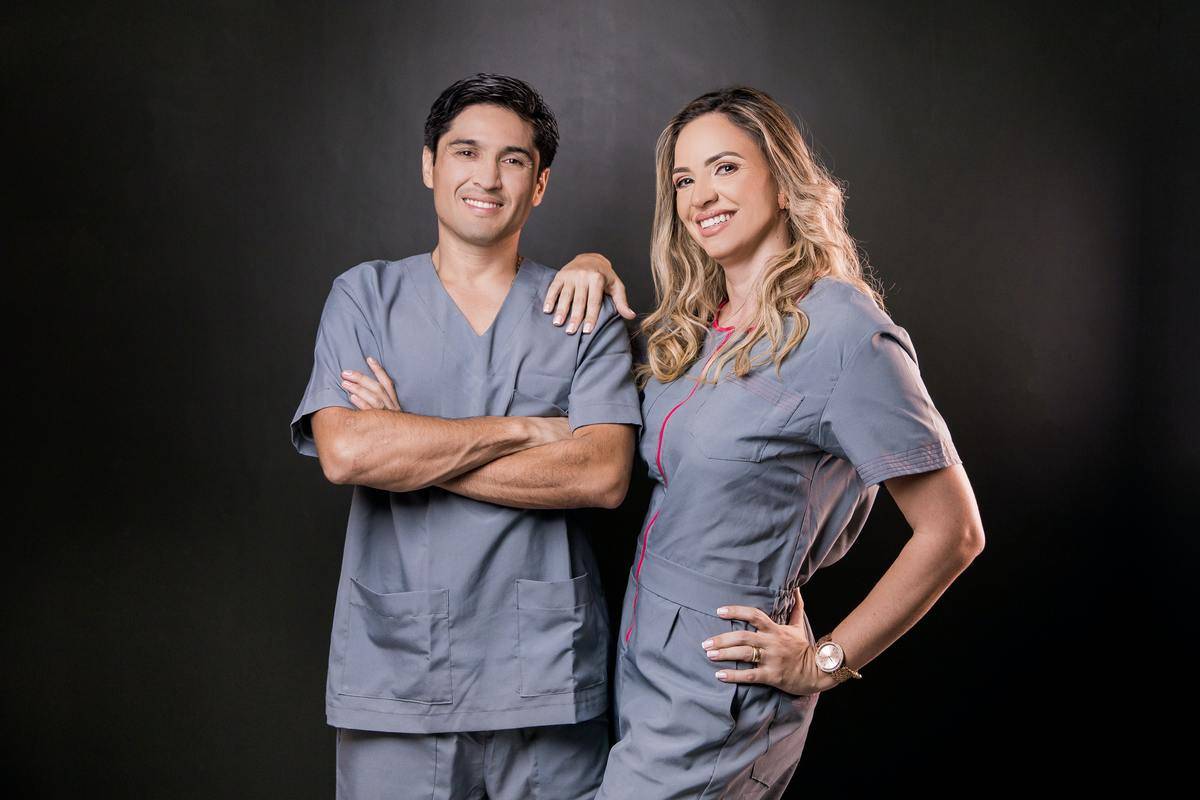 male and female doctors posing for a photo