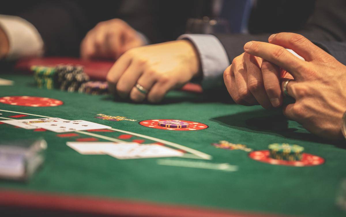 men sitting at table in casino