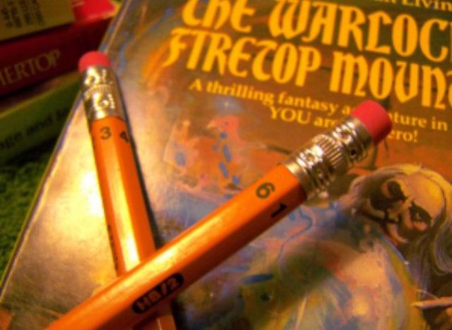 pencils with numbers 1-6 on the sides so they act as dice