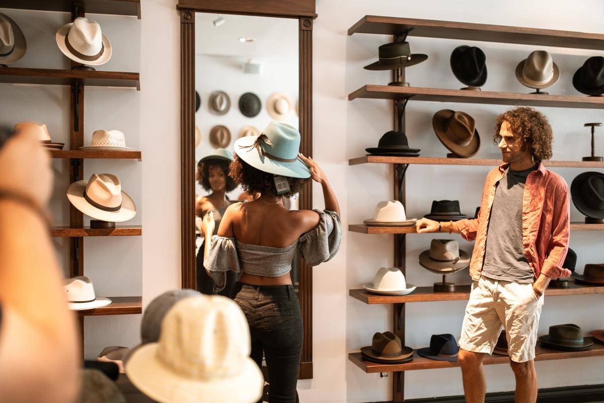 couple in hat store shopping