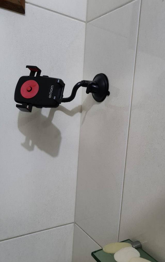 car phone holder on tile wall