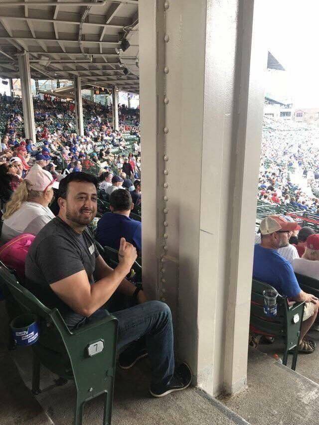 pole in front of guy at stadium