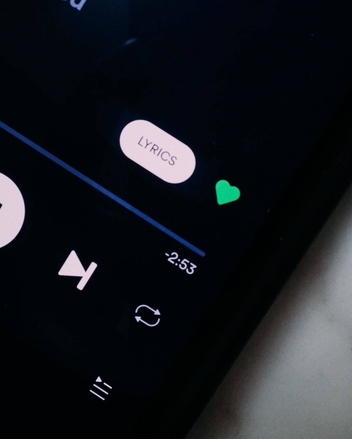 The lyrics function of Spotify is pictured on a phone.
