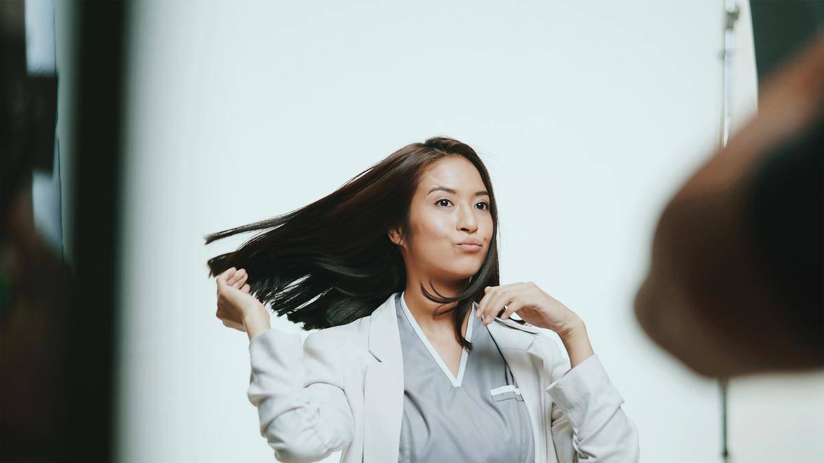 a doctor flipping her hair