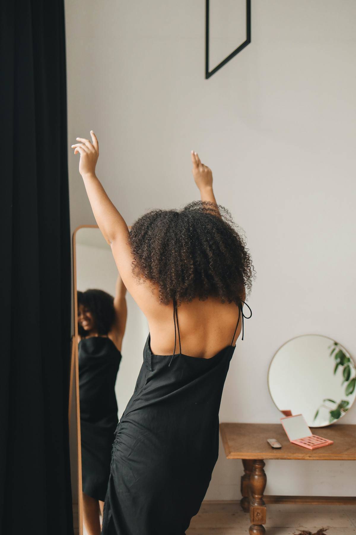 woman in front of mirror dancing