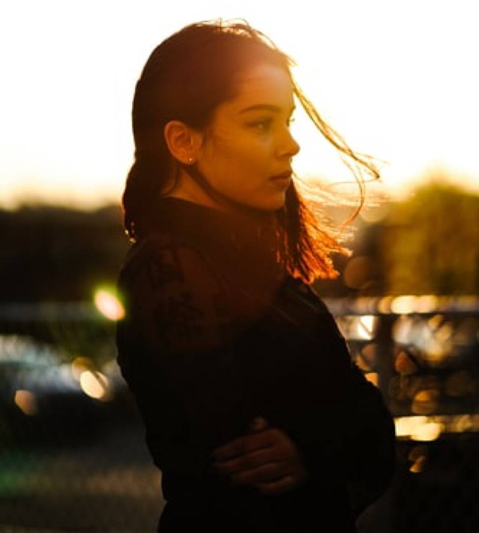 side profile shot of woman staring off into distance
