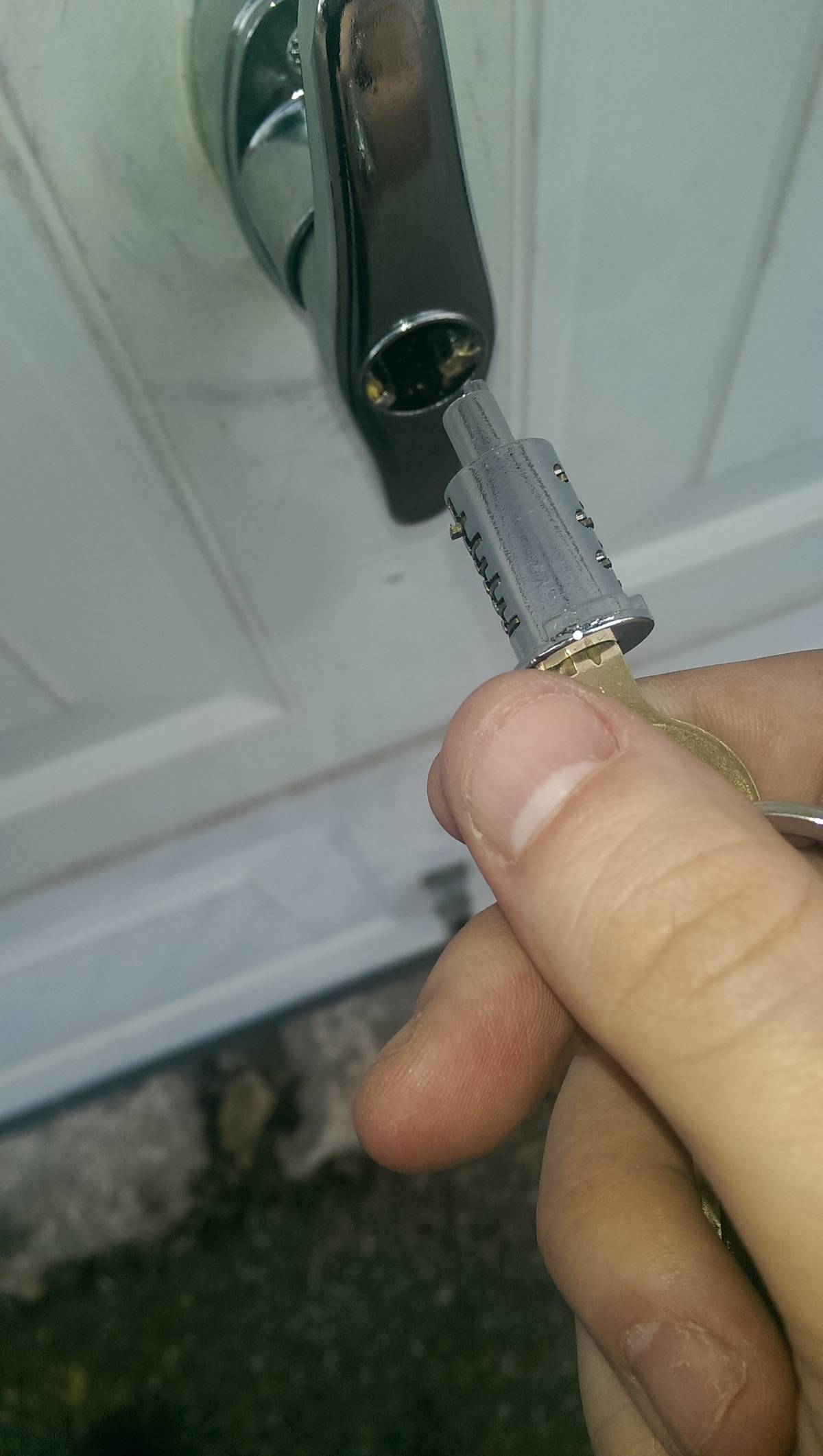 Broken lock mechanism on door with key stuck inside