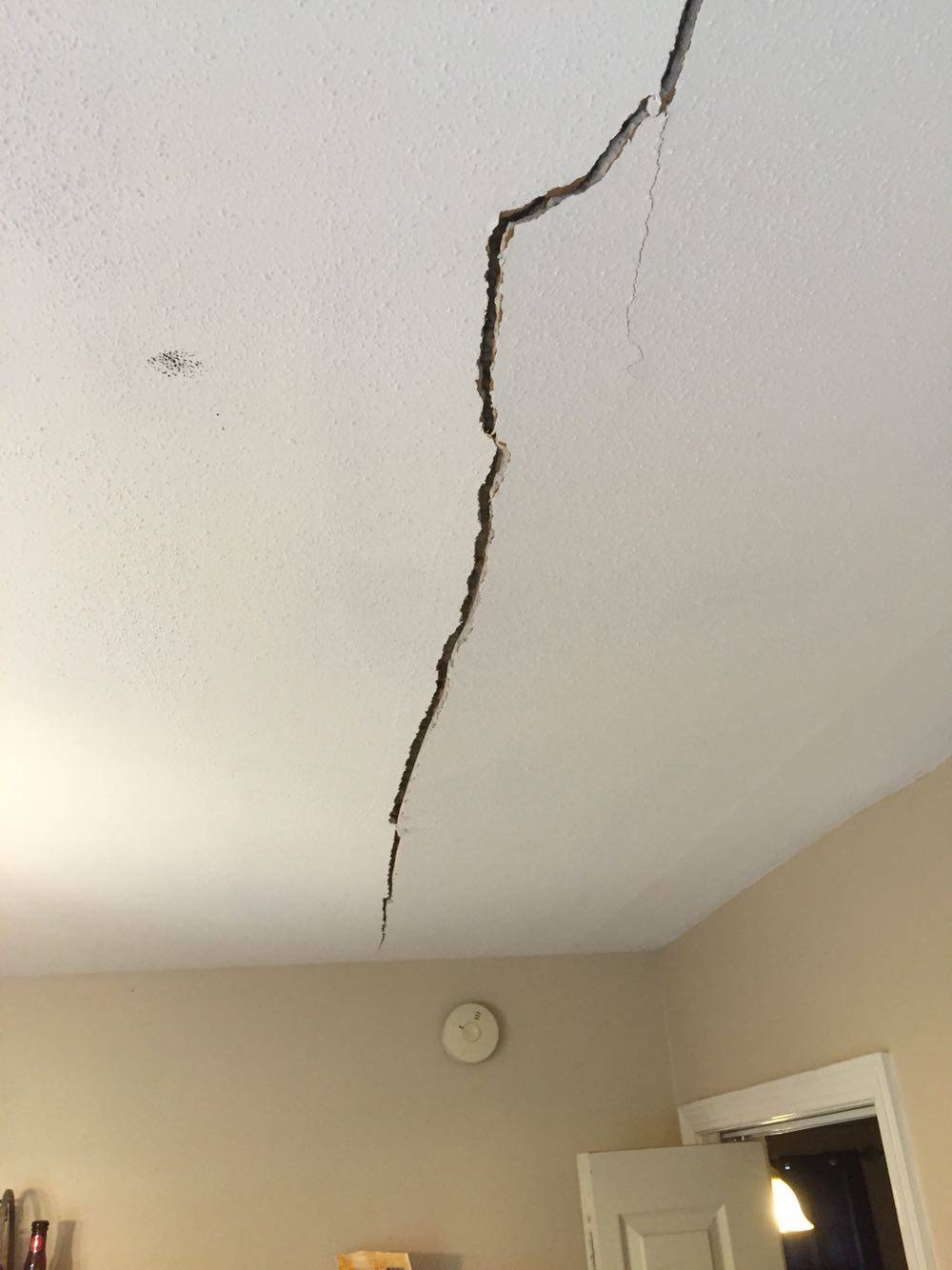 Large splitting crack in ceiling of home