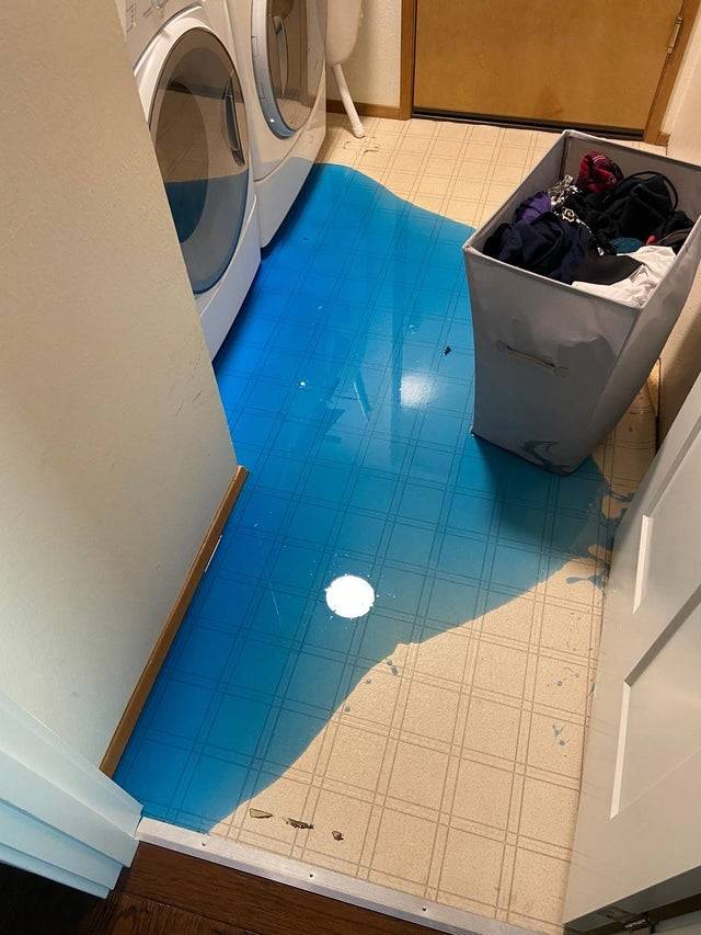 Costco-sized jug full of detergent spilled on the floor