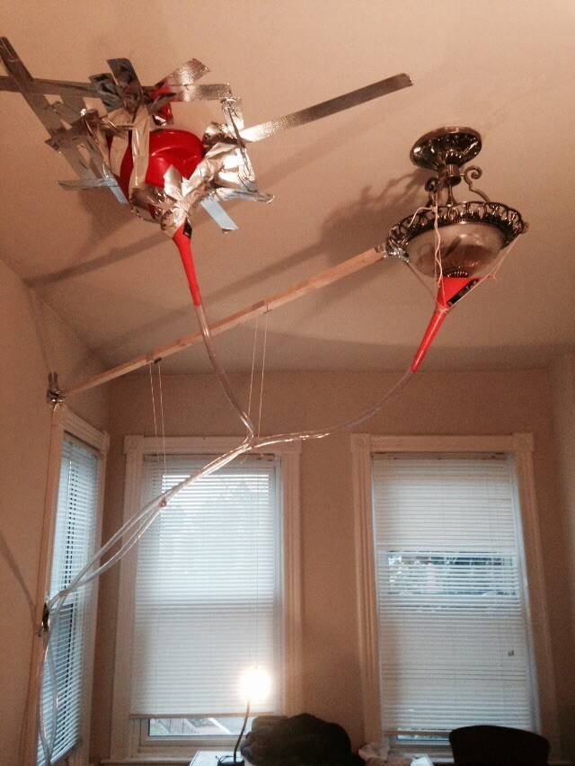 Leaky ceiling repaired with funnels and duct tape