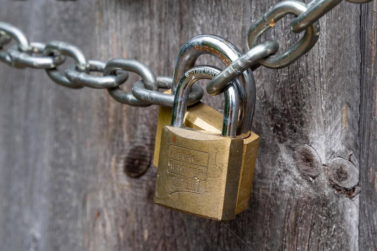 Gold locks on a metal chain