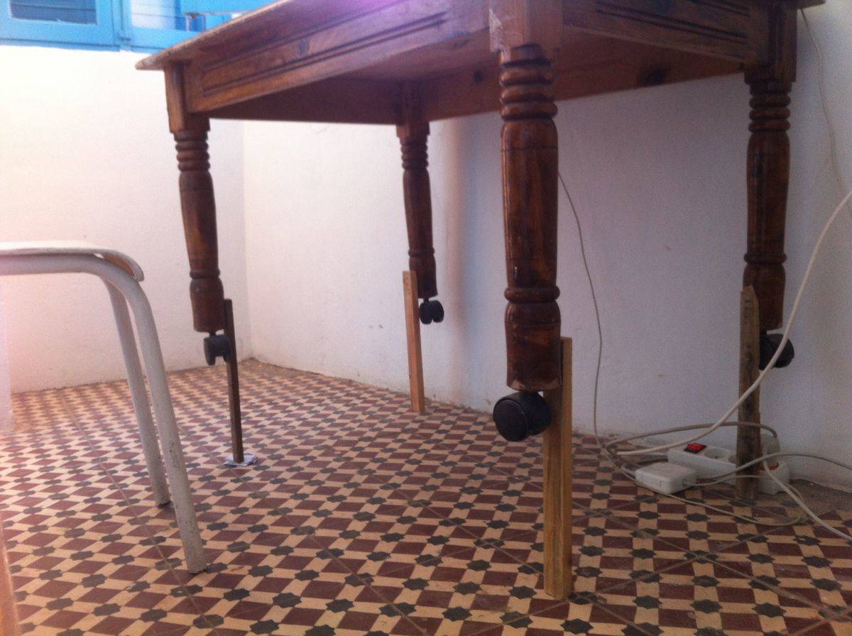 Raised DIY makeshift wooden table with extended legs