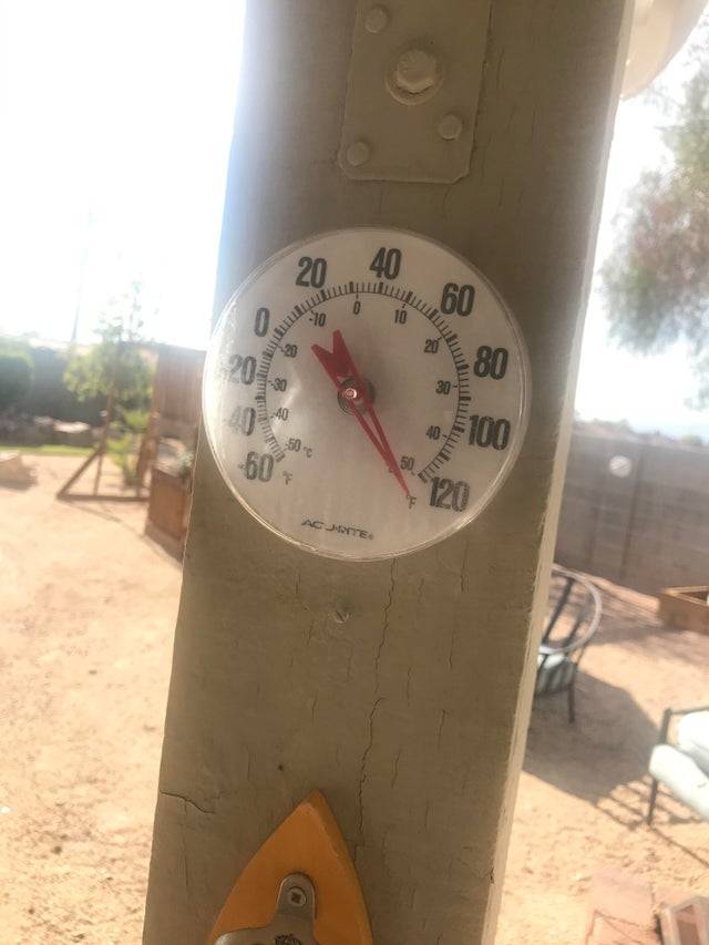Thermometer mounted outside that is at its max of 120 degrees F