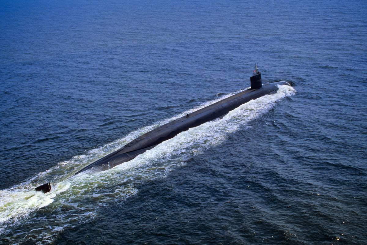 The USS Pennsylvania Nuclear Powered Ohio-Class Ballistic Missile Submarine cruises across the ocean surface.